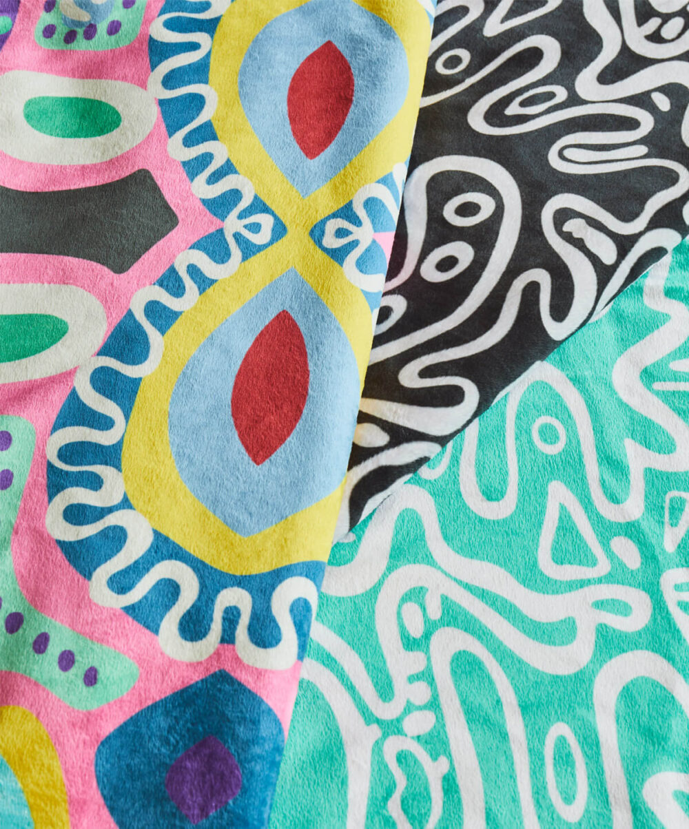 Plush velvet face and Soft Sherpa Fleece Back Throws flat